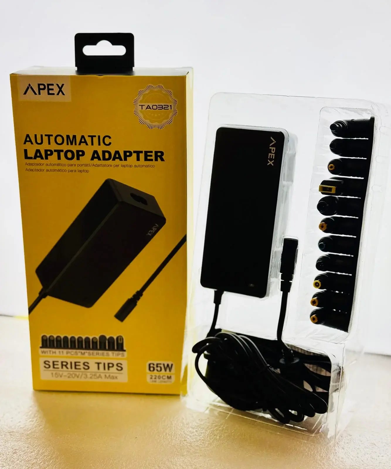 APEX automatic laptop adapter with packaging and accessories on a white background