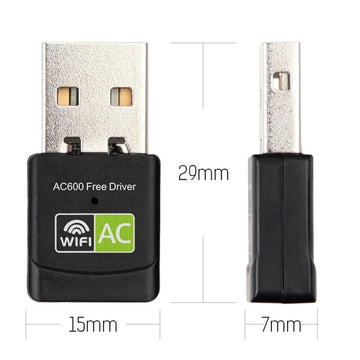 Compact dual-band USB WiFi adapter next to a notebook computer