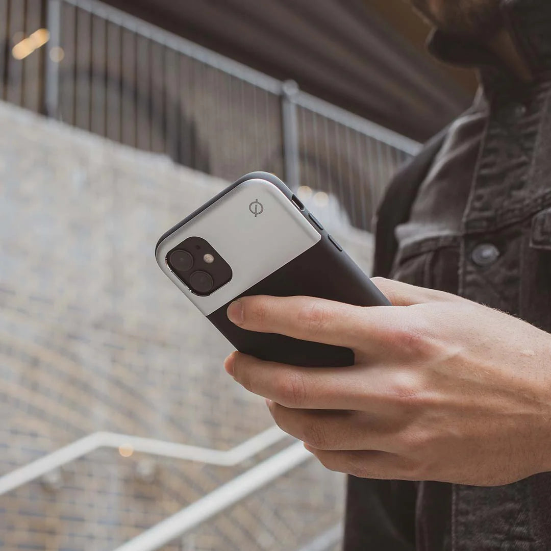 atom studios case for iphone 7 8 se held. by man