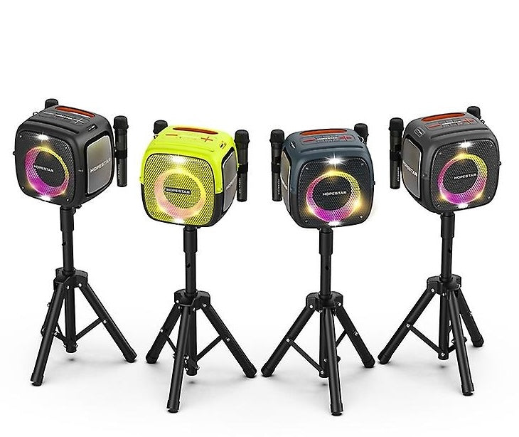 Four portable speakers on stands with colorful lights on a white background
